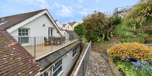 Deck overlooks mature terraced gardens 